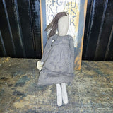 Primitive Doll Holding A Piece Of Fabric That Has ABC,123 Stocked In To It