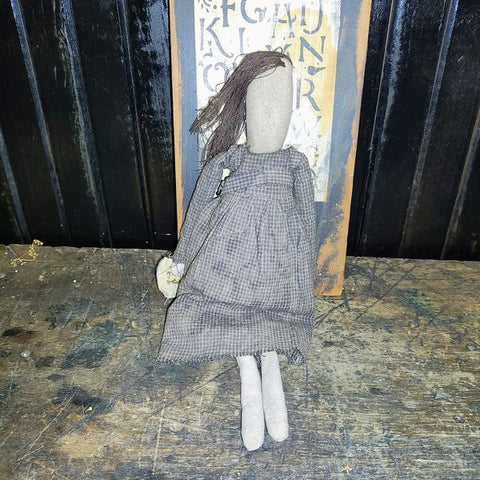 Primitive Doll Holding A Piece Of Fabric That Has ABC,123 Stocked In To It