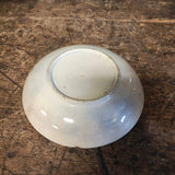 Antique handle less flow blue cup and saucer