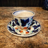 Antique handle less flow blue cup and saucer