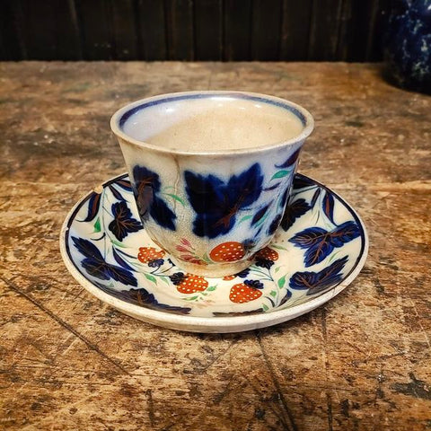 Antique handle less flow blue cup and saucer