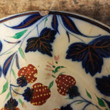 Antique handle less flow blue cup and saucer