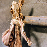 Antique primitive hanger with dried tobacco leaves