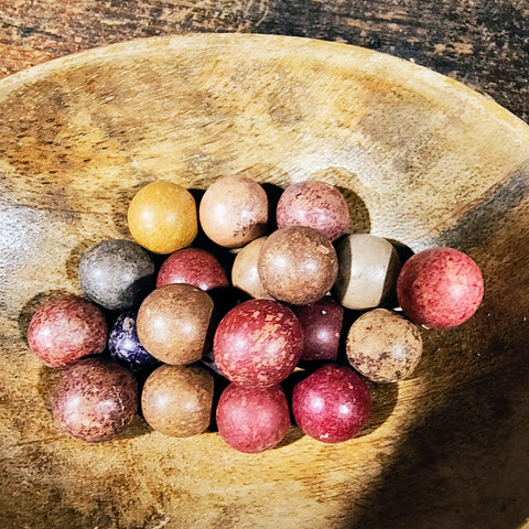 Antique Clay Marvels in an antique wooden bowl