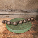 Antique primitive bells on a leather strap