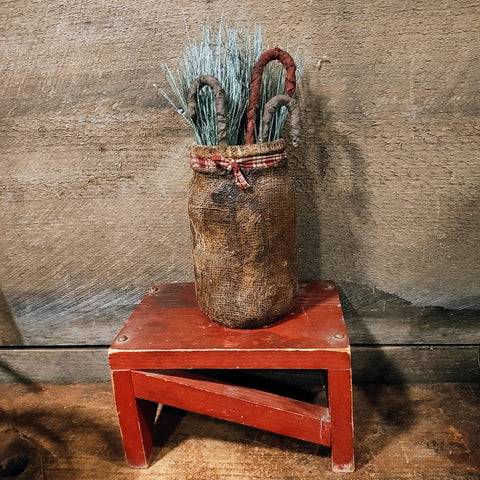 Primitive Jar With fabrics Candy Canes And Greenery
