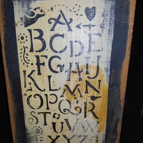 Primitive Stenciled ABCs On An Old Piece Of Board