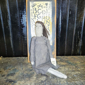 Primitive Doll Holding A Piece Of Fabric That Has ABC,123 Stocked In To It