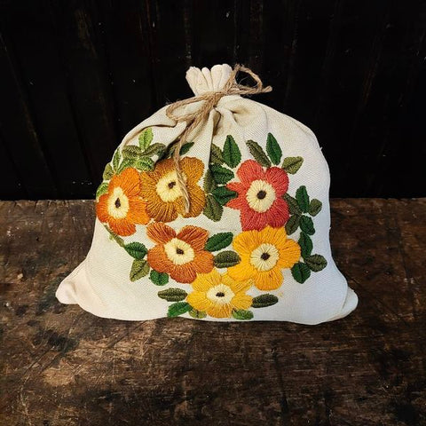Vintage embroidered flowers on a linen bag