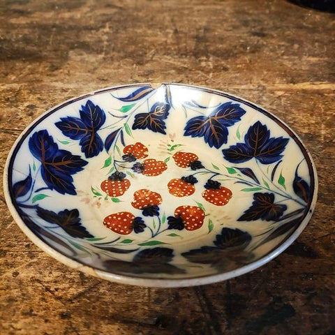 Antique handle less flow blue cup and saucer