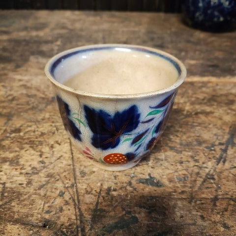 Antique handle less flow blue cup and saucer
