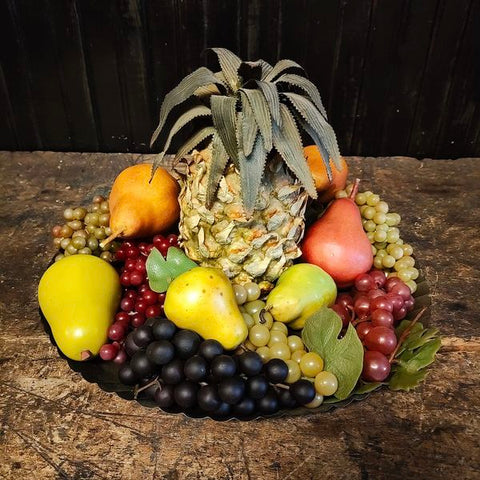 Decorative fruit lot with tin fluted platter