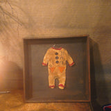 Antique primitive wooden box with a handmade Halloween costume