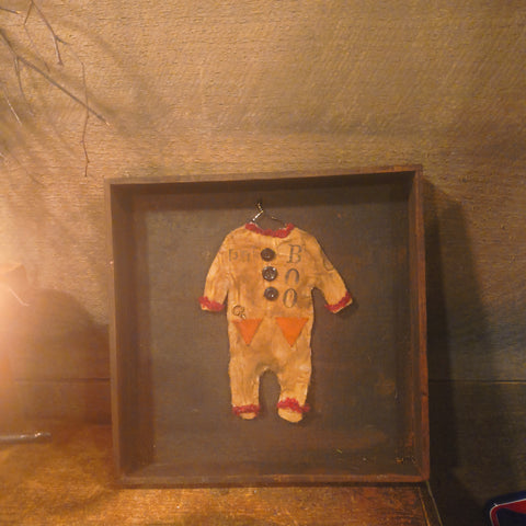 Antique primitive wooden box with a handmade Halloween costume