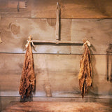 Antique primitive hanger with dried tobacco leaves