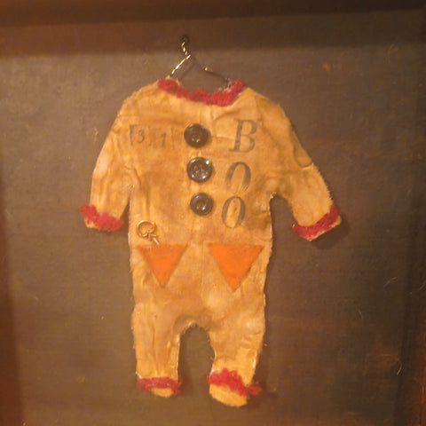 Antique primitive wooden box with a handmade Halloween costume