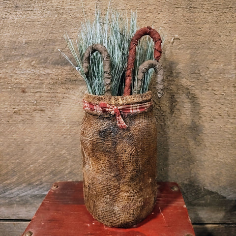 Primitive Jar With fabrics Candy Canes And Greenery