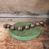 Antique primitive bells on a leather strap