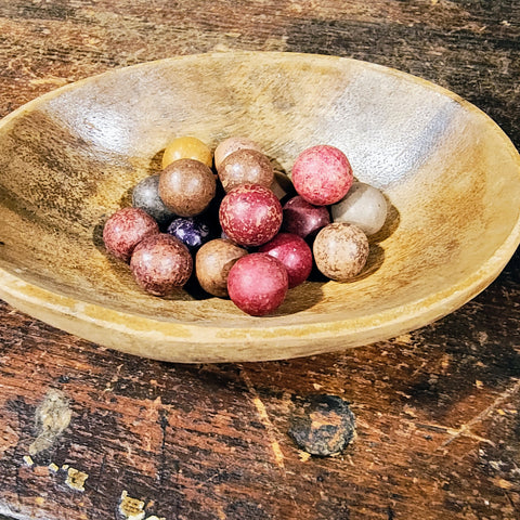 Antique Clay Marvels in an antique wooden bowl