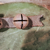 Antique primitive bells on a leather strap