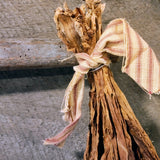 Antique primitive hanger with dried tobacco leaves