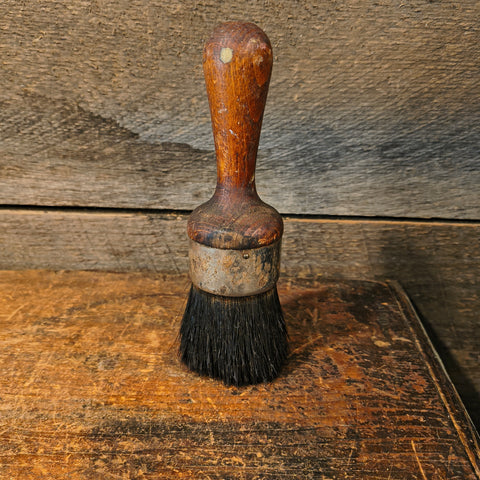 Vintage all-pure bristle round paint brush with a wooden handle.